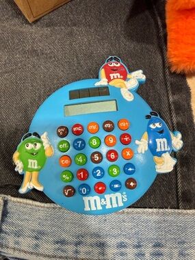 M&M'S Blue Round Calculator with Red, Green, Blue & Brown Character Buttons